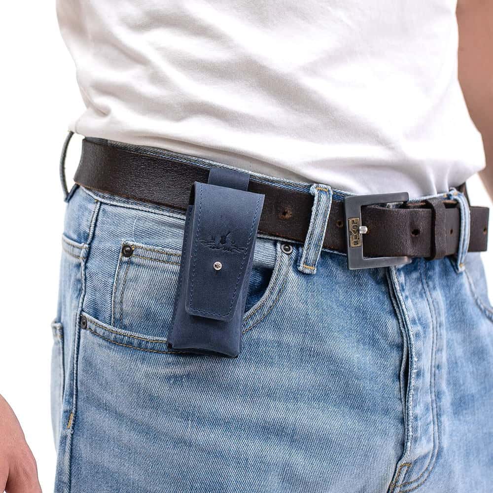 Dark Blue leather harmonica holster attached to black leather belt over jeans