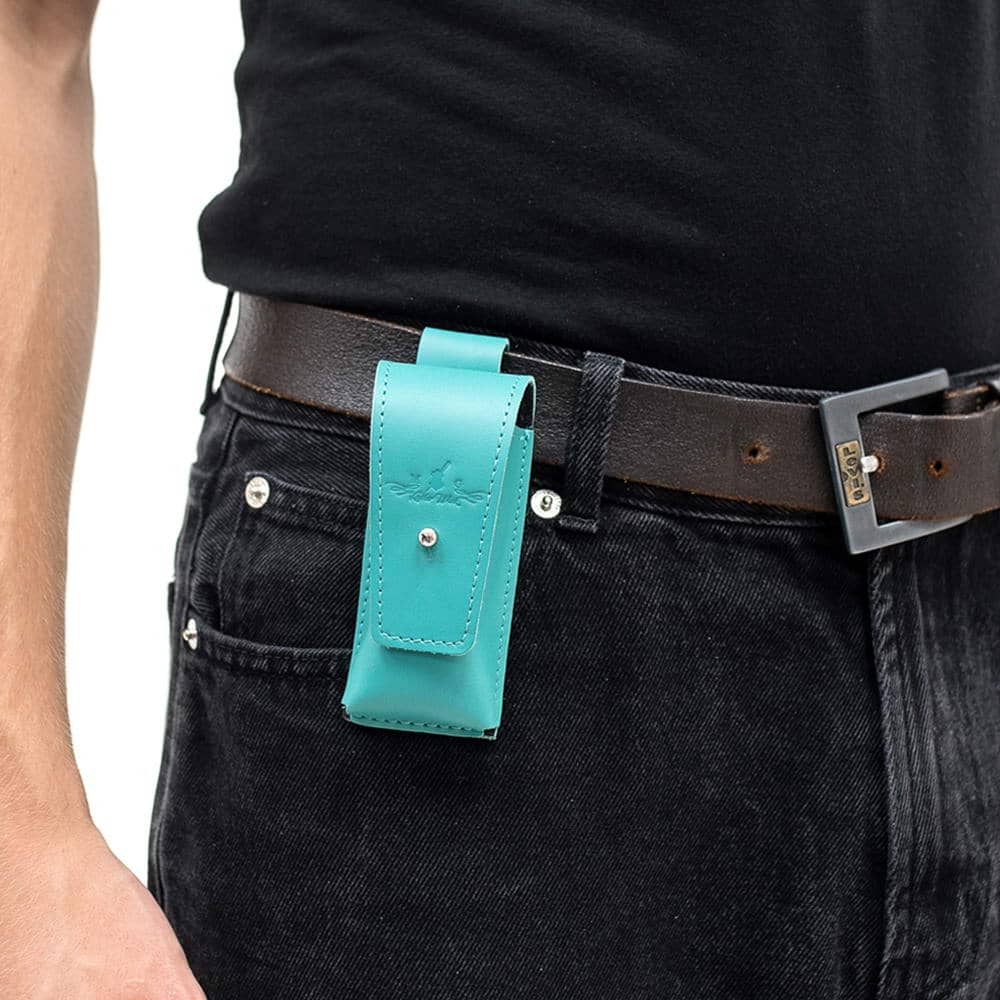Tiffany harmonica case attached to black jeans belt