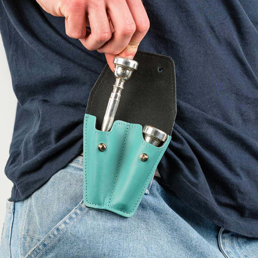 Trumpet double mouthpiece holder in Tiffany Crazy Horse leather — musician removing mouthpiece