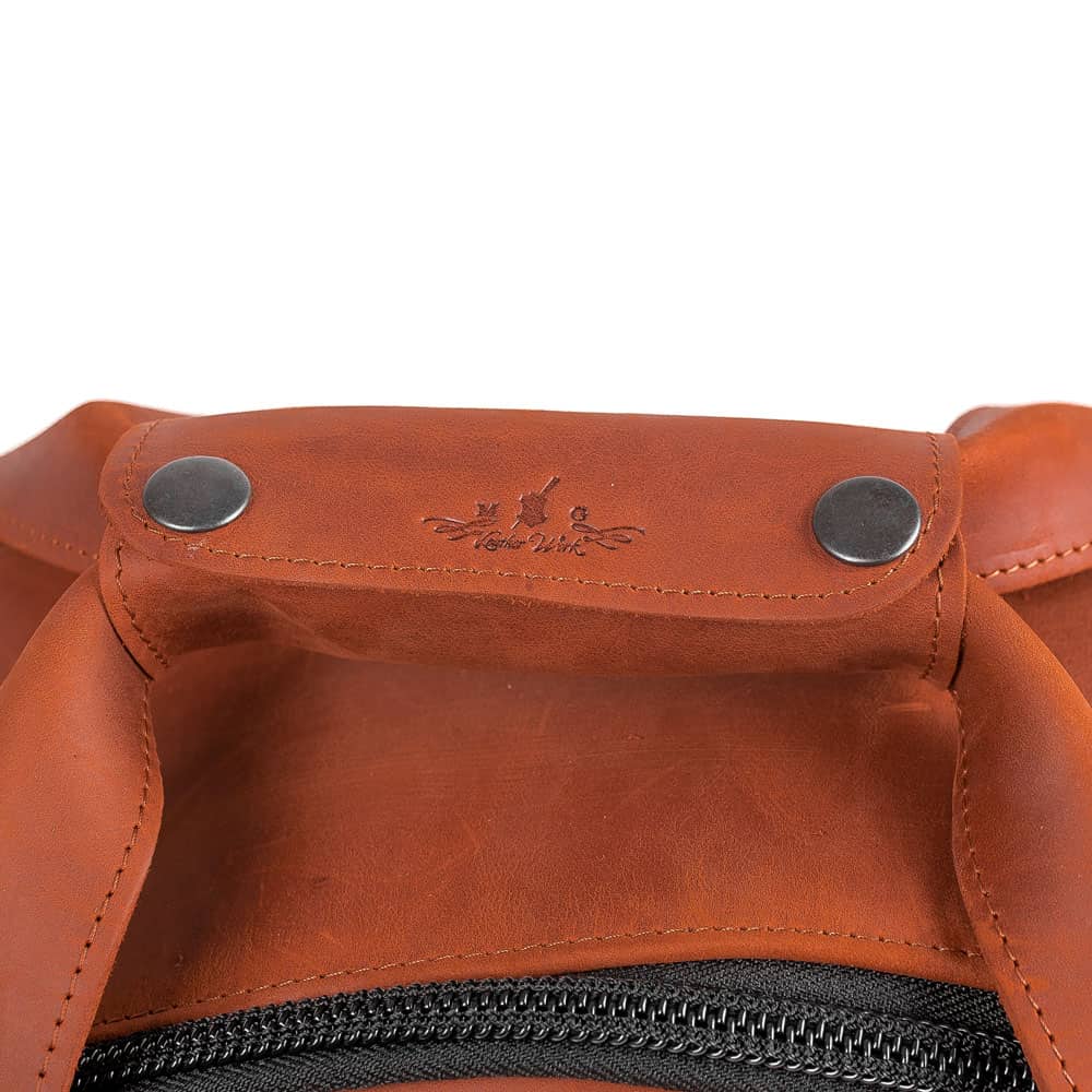 Front view of the MG Leather Work Tenor Saxophone Bag in Light Brown, featuring a side pocket, horizontal and vertical handles.