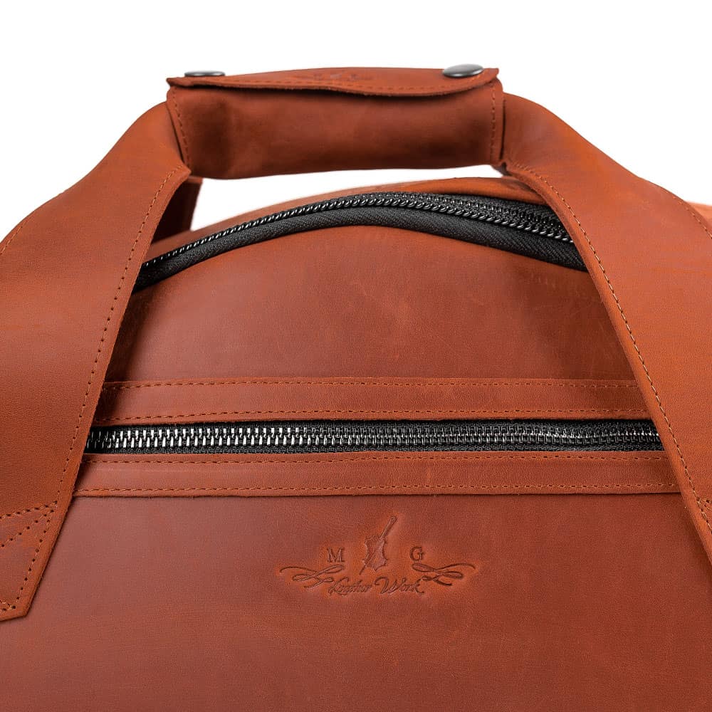 Close-up of the front pocket and horizontal carry handle on the MG Leather Work Tenor Saxophone Gig Bag in Light Brown Leather