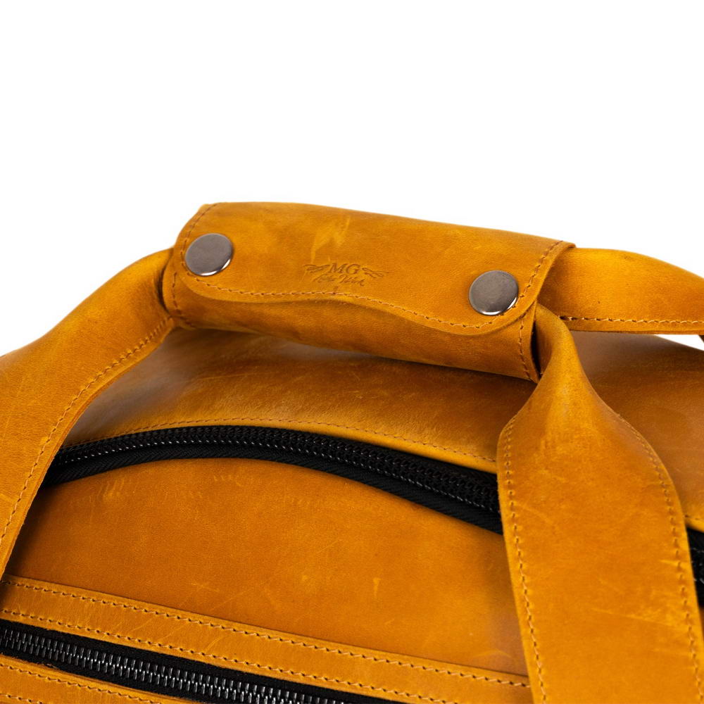 Close-up of the horizontal carry handles of the Tenor Saxophone Bag, reinforced with a leather patch and rivets