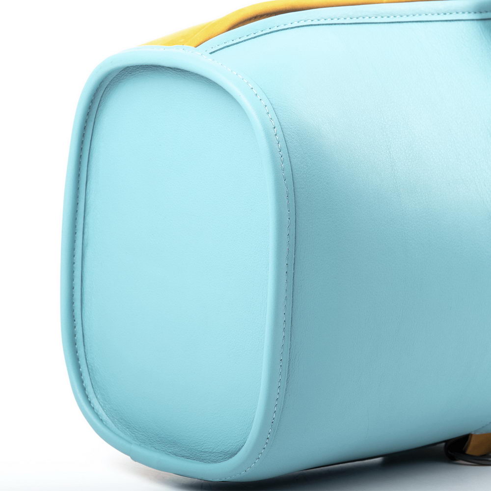bottom of the Tiffany leather trumpet gig bag, close-up showing stitching details and smooth leather texture