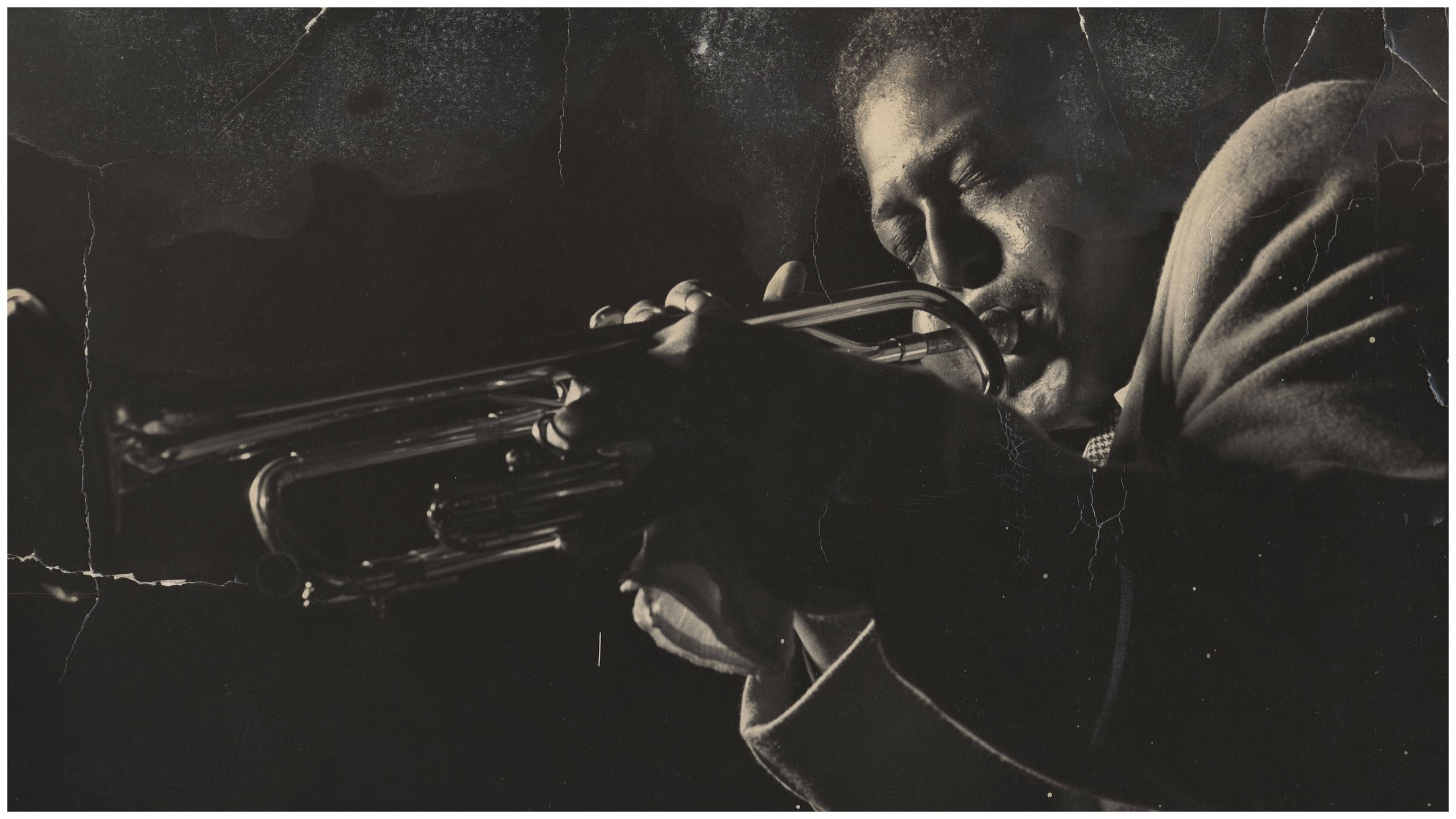 Fats Navarro playing trumpet on stage — legendary jazz musician known for his influence on modern trumpet style.