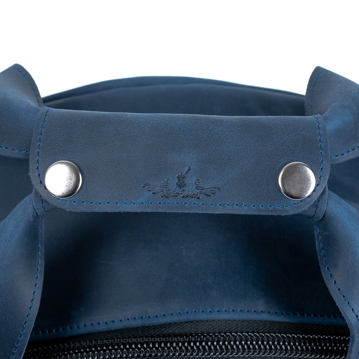 Close-up of the horizontal leather carry handles on the MG Leather Work Alto Saxophone Gig Bag in Dark Blue Crazy Horse leather, reinforced with rivets for durability.