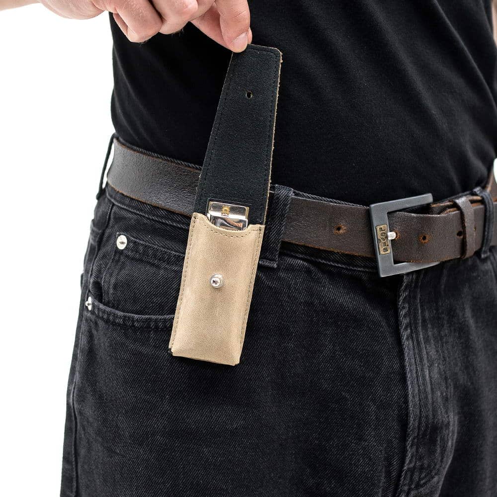Beige harmonica holder on belt with flap lifted to reveal instrument inside.