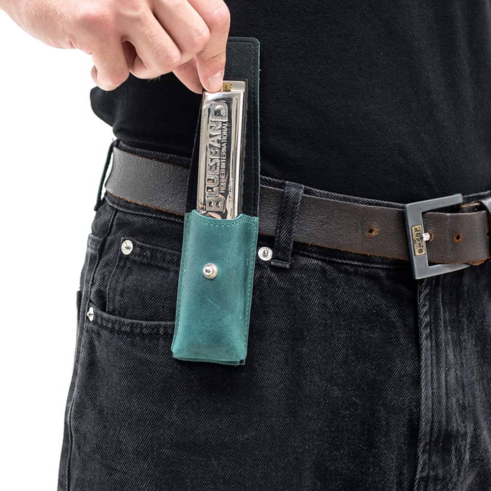 Handcrafted opal leather harmonica holder pouch with snap button closure, worn on a belt.