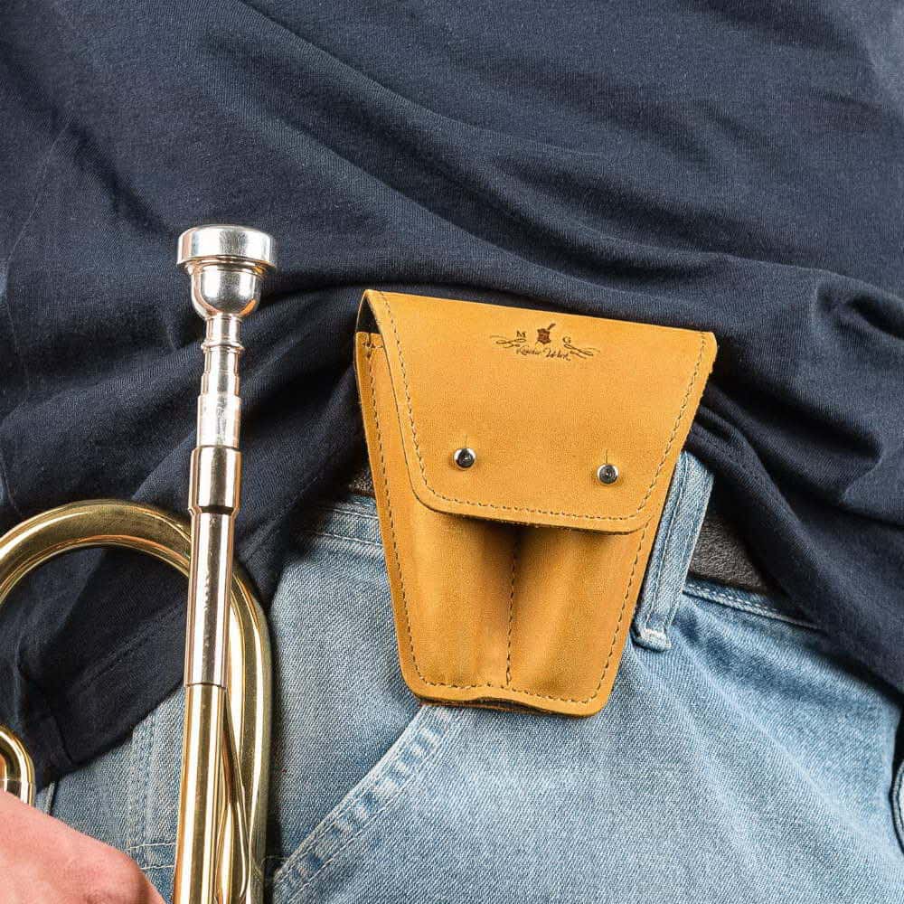 Trumpet double mouthpiece case in yellow Crazy Horse leather — attached to musician’s belt