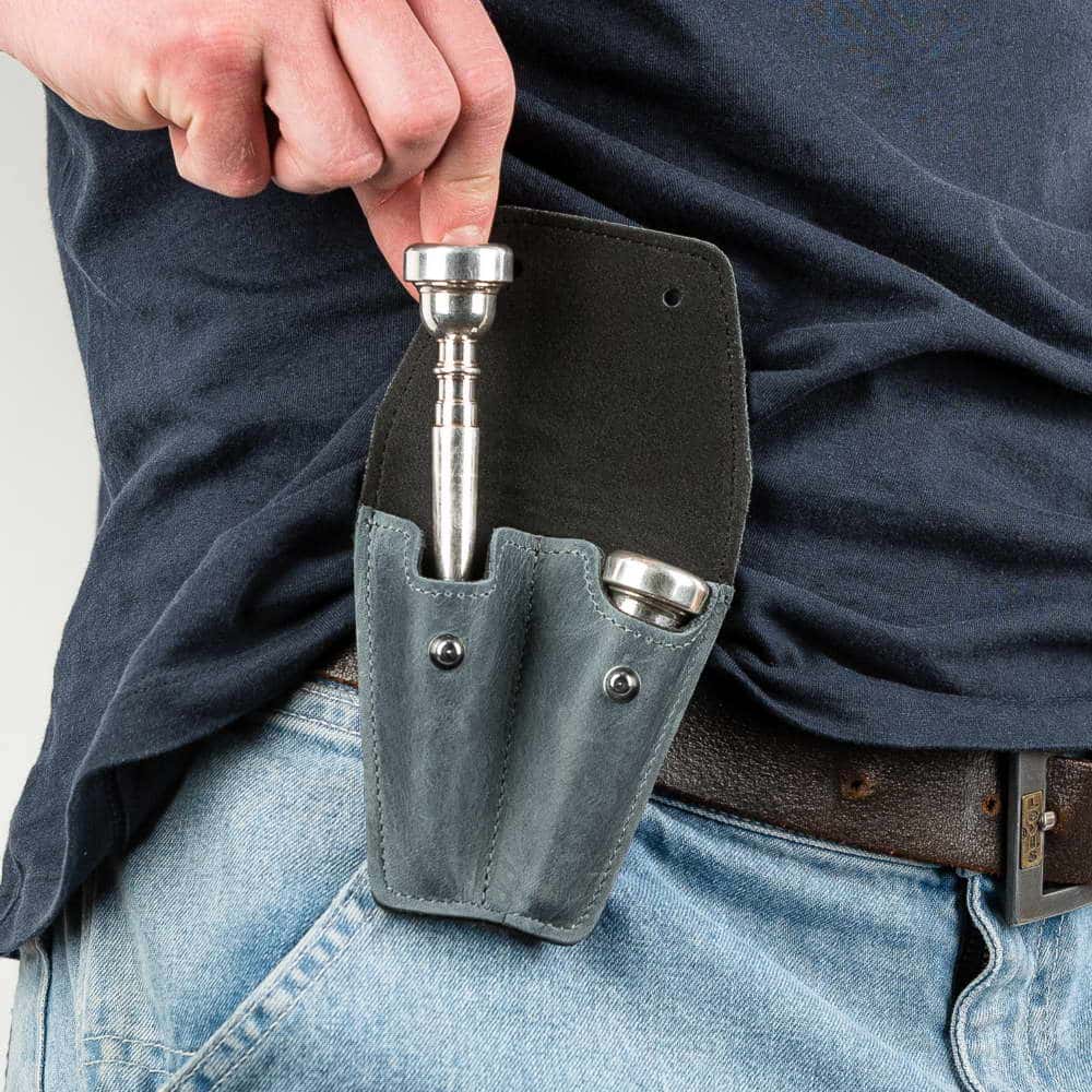 Trumpet double mouthpiece holder in gray Crazy Horse leather — musician removing mouthpiece