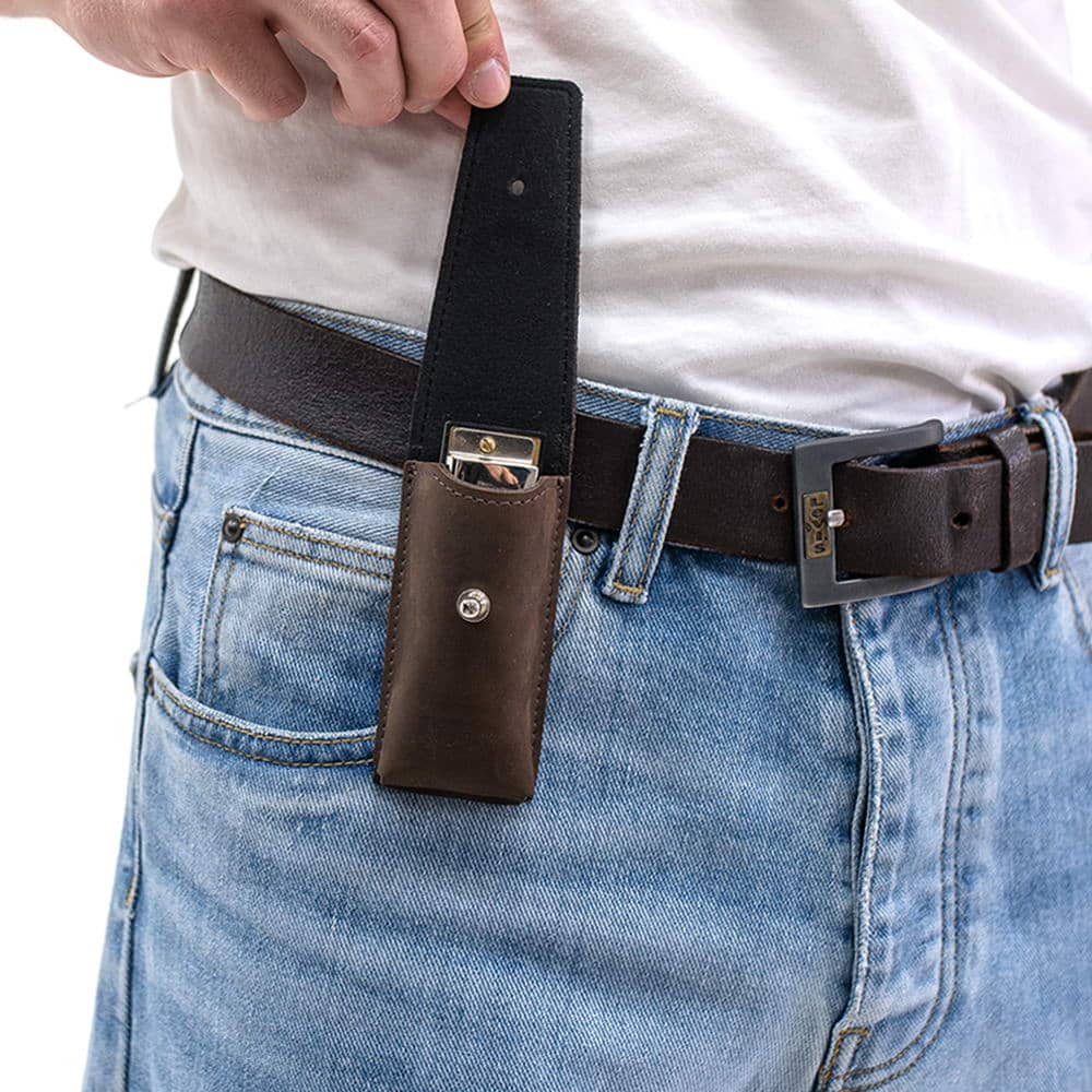 Brown harmonica leather holder on belt with flap open, harmonica inside