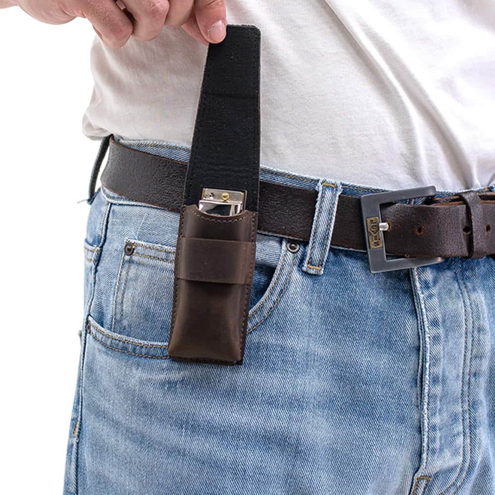 Brown harmonica holster with belt clip and open flap revealing instrument inside.