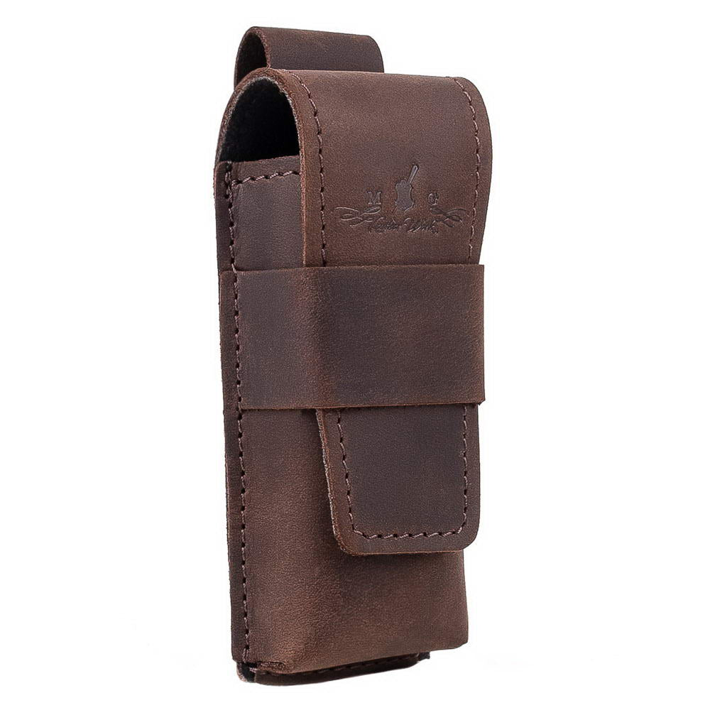 Angled close-up of brown harmonica leather holster with reinforced flap.