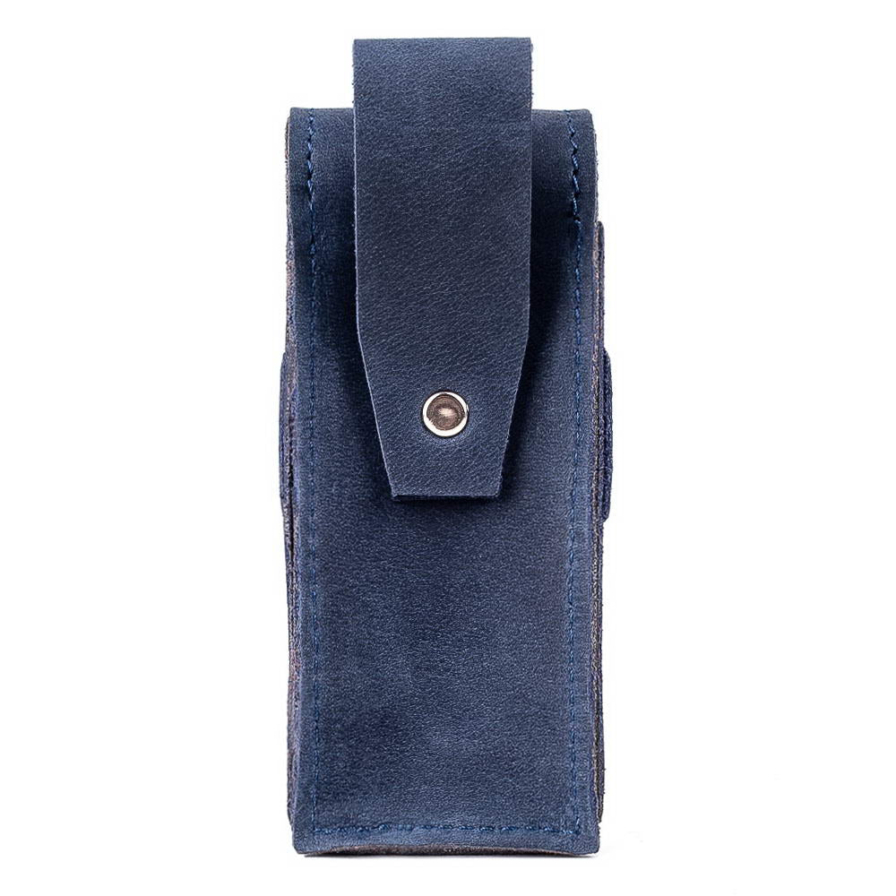 Back side of dark blue harmonica leather case with belt loop.