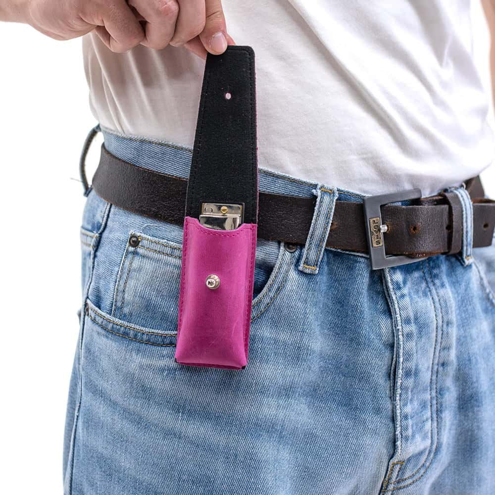 Rose leather harmonica holder on belt with flap open, harmonica inside