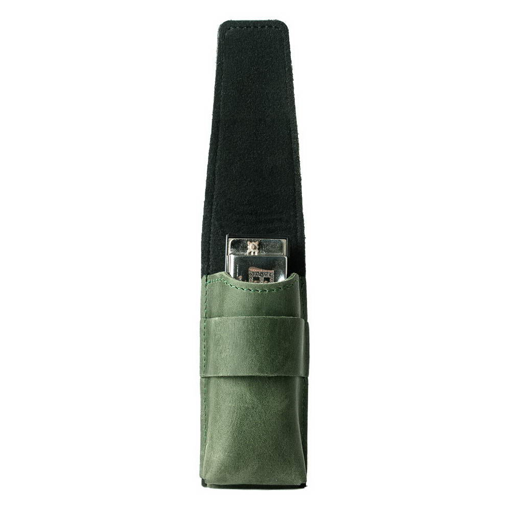 Green leather harmonica case with harmonica inside, open to display details.