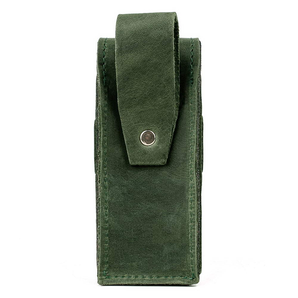 Back of green leather harmonica case with belt clip.