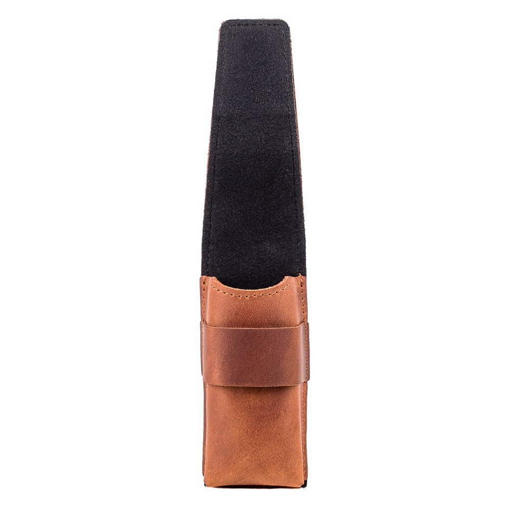 Side perspective of light brown harmonica holder, flap open to reveal harmonica.
