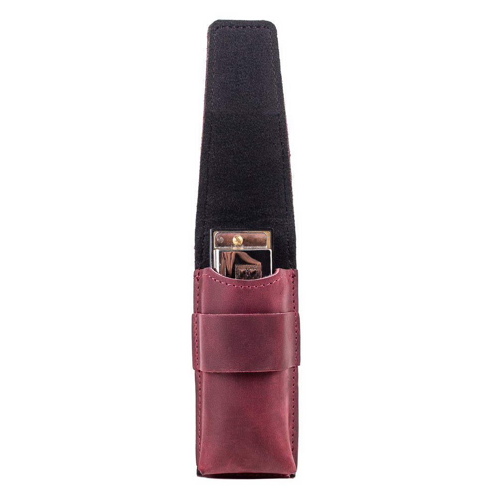 Marsala leather harmonica case with harmonica inside, flap open for view.