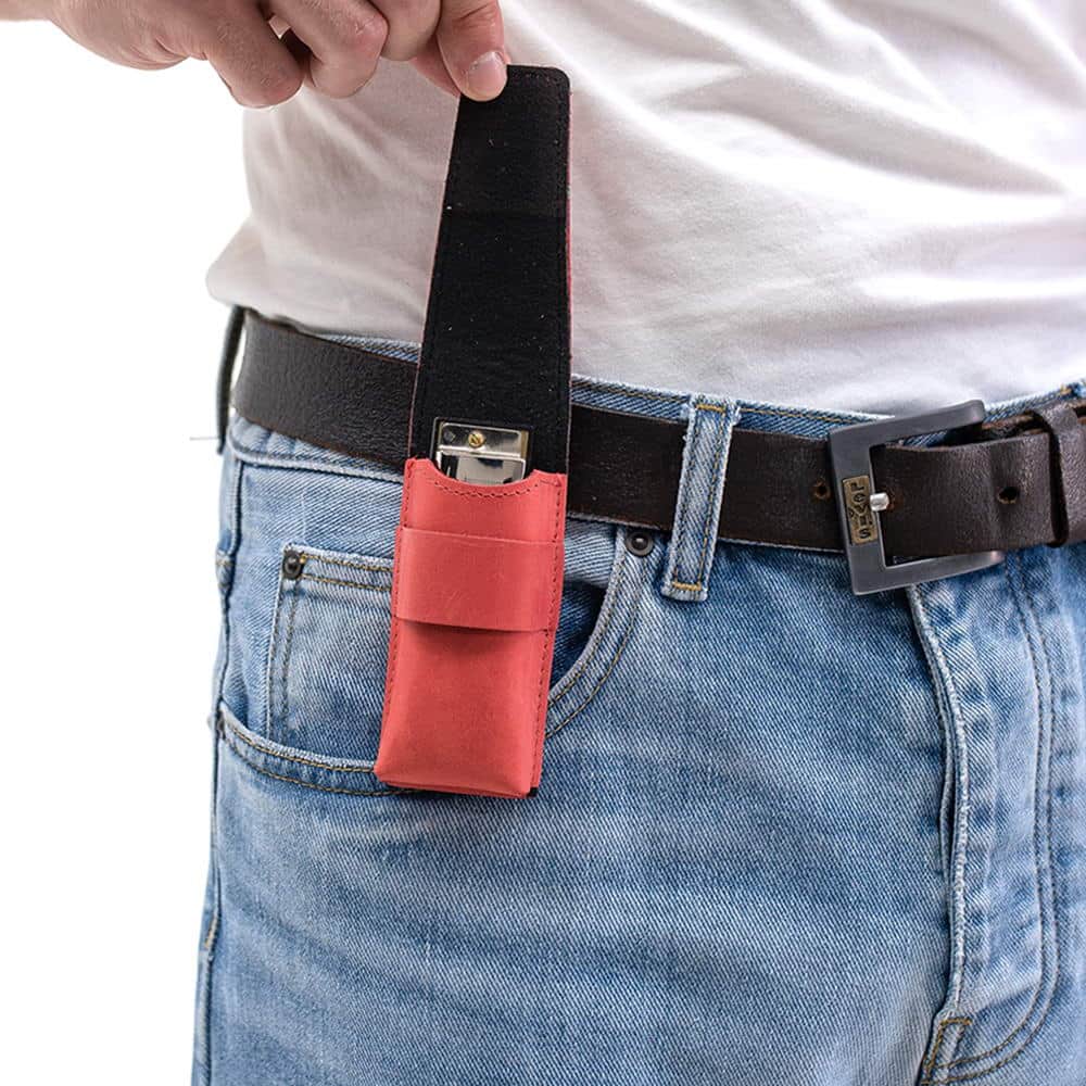 Red harmonica holster with belt clip and flap open showing harmonica.