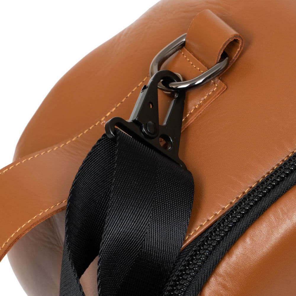 Close-up of the attachment ring on the side of the Tenor Sax Gig Bag in Light Brown, with a strap carabiner securely attached.